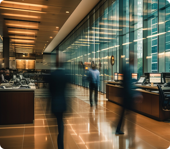 People walking down office lobby